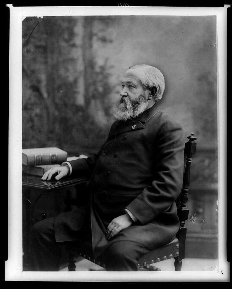 Benjamin Harrison, three-quarter length portrait, seated, facing left, with right hand on table LCCN96524264
