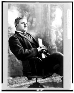 Benjamin Ryan Tillman, three-quarter length portrait, seated, facing right holding the Washington Post LCCN91482981