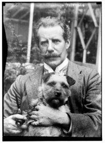 Bernard M. Partridge holding dog LCCN2014685481