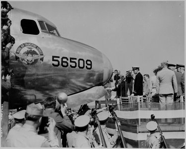 Bess Truman christening a Naval Air Transport Service airplane. A view from the side. - NARA - 199101