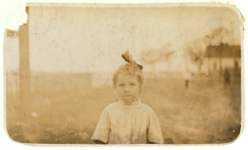 Bessie Thompson, a tiny 'helper' in the Barataria Canning Compnay. See other photos and labels. LOC cph.3a01048