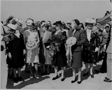 Bess Truman and Margaret Truman hold bouquets during the christening ceremony for two airplanes. - NARA - 199102 photo