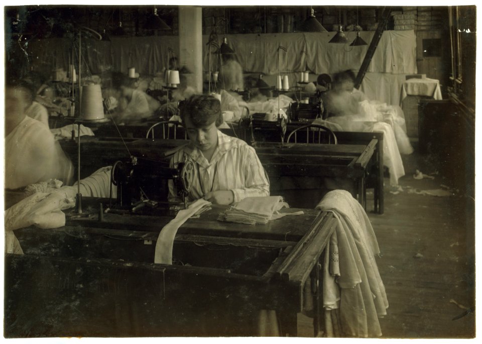Bessie Blitch, 15 years old. Sewing curtains on machine at Boutwell, Fairclough & Gold, 274 Summer Street Extension. Lewis W. Hine. (Mr. Fitzgerald, Manager.) LOC nclc.05192