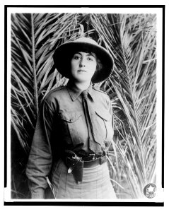 Between savage and tiger. Three quarter length of woman in riding costume LCCN2003675559