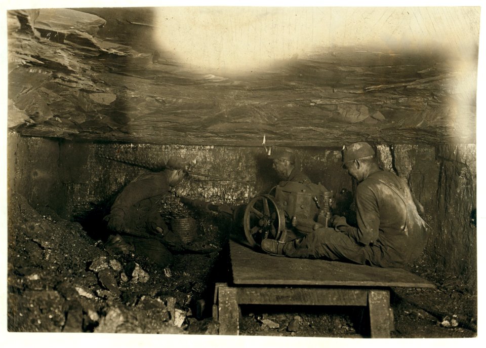 Brown Mine. Man digging coal by machinery low ceiling- scales off and drops. LOC cph.3a29784