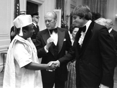 Bruce Jenner greets Gerald Ford and William Tolbert in 1976 (cropped) photo
