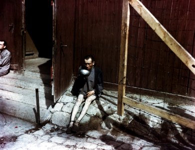 Buchenwald survivor drinking from a bowl - 2