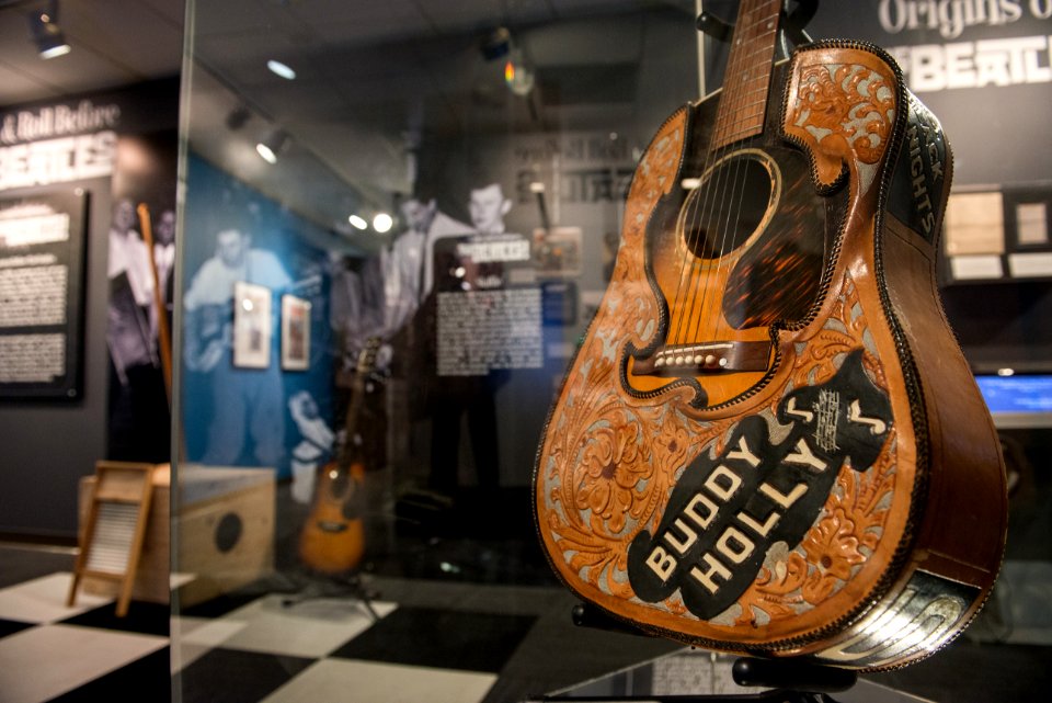 Buddy Holly's Gibson J-45 with leather cover - Ladies and Gentlemen... the Beatles! exhibit at LBJ Presidential Library, Austin, TX, 2015-06-23 16.12.04