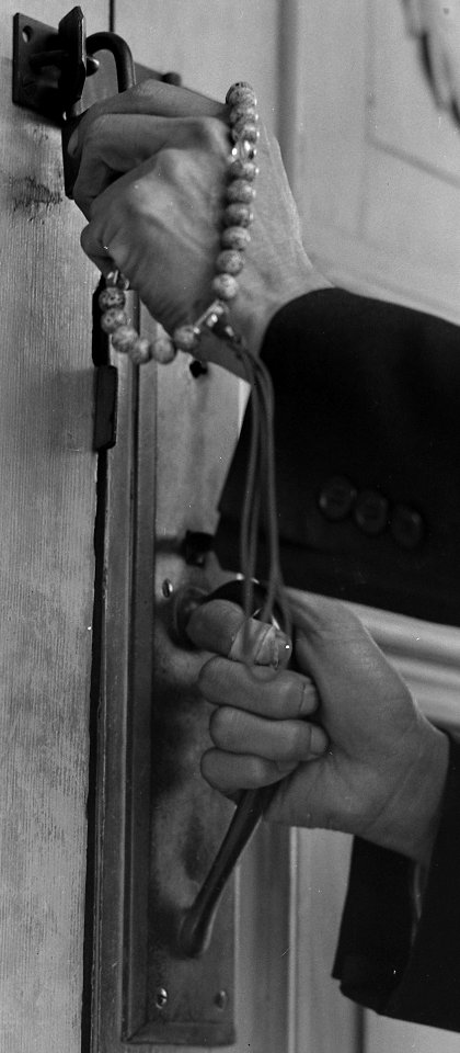 Buddhist prayer beads and hands detail, Florin, California. Hands of Reverend Naito (Buddhist priest) are here as he locks the door of his . . . - NARA - 537853 (cropped)
