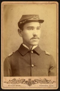 Buffalo soldier, African American officer, Lt. 1st Infantry, four button sack with crossed rifles and 1 on kepi) - Staley Bros., photographers and portrait artists, Tullahoma Tenn LCCN2010645142