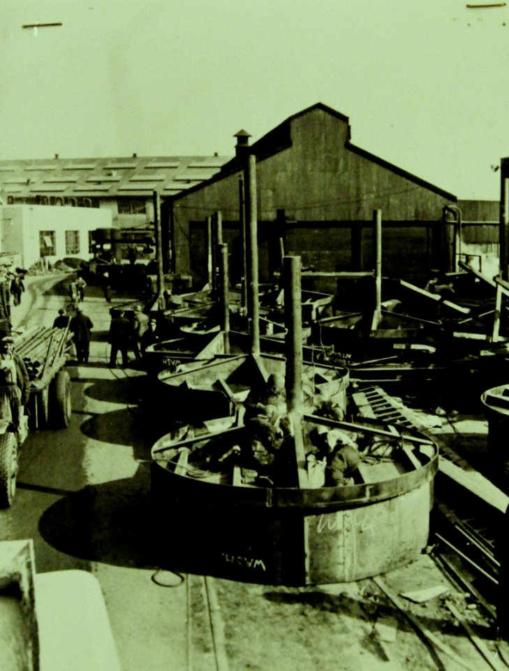 Building machine gun turrets for commercial cargo shipping, WWII (23824105856)