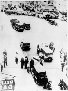 Bullet-riddled taxi and the bodies of two gangsters in a New York City street after a gun battle with police, 1931 - NARA - 541879