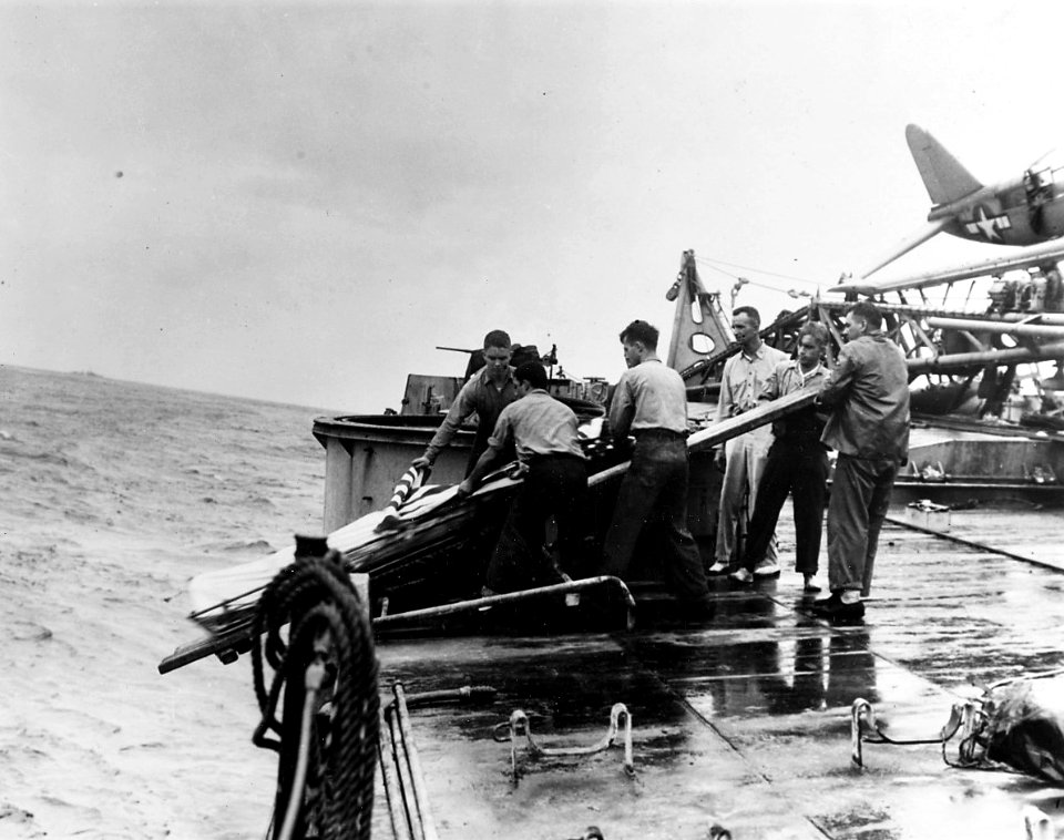 Burial at sea for crewmen killed aboard USS Houston (CL-81) after the ship was torpedoed on 14 October 1944 (19-N-110835)