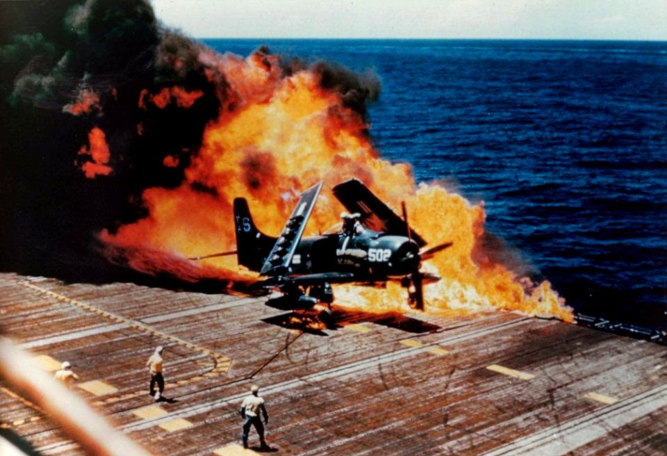 Burning AD-4 Skyraider of VA-55 on USS Essex (CVA-9) c1954
