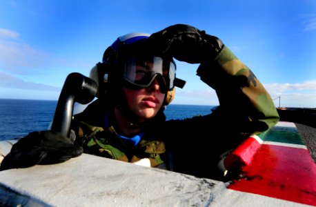 US Navy 091104-N-9928E-155 Aviation Boatswain's Mate (Handling) Airman Kyle Bush, from Evansville, Ind., mans a sound-powered phone during drills on the flight deck of the Nimitz-class aircraft carrier USS John C. Stennis (CVN photo