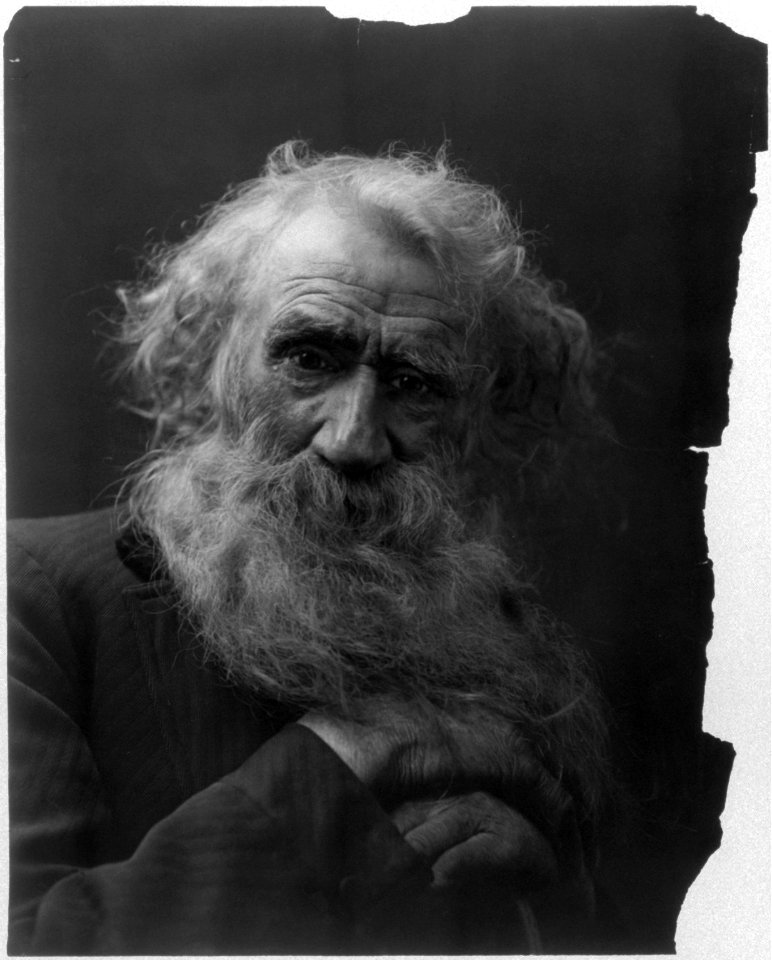 Bust of bearded old man with gnarled hands LCCN2003675173