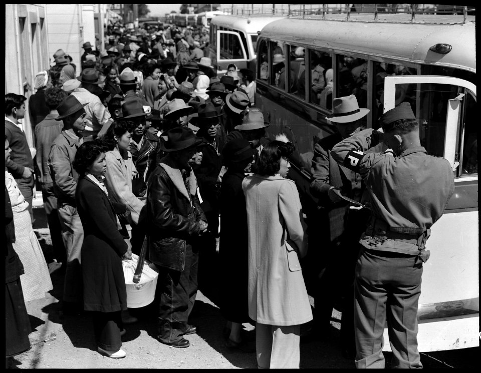 Byron, California. Farm families of Japanese ancestry boarding buses for Turlock Assembly center 65 . . . - NARA - 537458