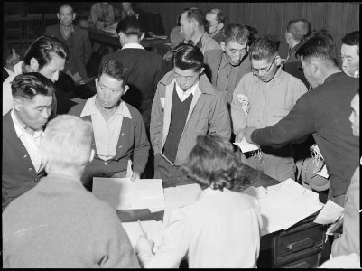 Byron, California. Three days before evacuation these people of Japanese ancestry are receiving the . . . - NARA - 537697 photo