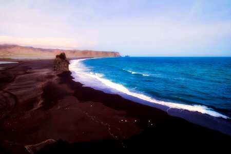 Black sand waves coast photo