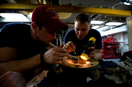 Cleaning a check valve 130209-N-IY633-042