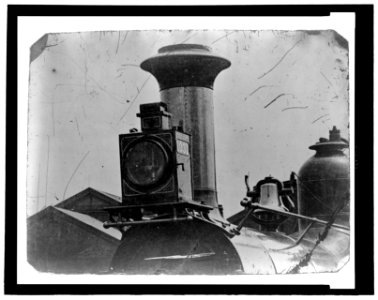 Close up view of front of locomotive, showing light, smoke stack and bell LCCN2006689582
