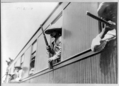 Close-up of insurrectors with rifles leaning out of railroad train windows LCCN2007677279