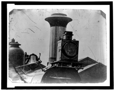 Close up view of front of locomotive, showing light, smoke stack and bell LCCN2006689582