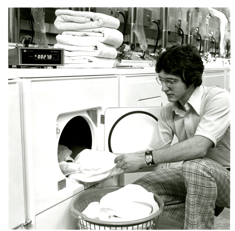 Closer view of engineer Robert Palla of the Advanced Measurement Technology Section checking one of the test dryers1