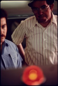 Closeup of a Motorist Who Has Just Gotten Out of His Station Wagon to Look at the Exhaust Analyzer Which Gives Readings on Carbon Monoxide and Hydrocarbon Emissions From His Vehicle...08-1975 (4265781389)