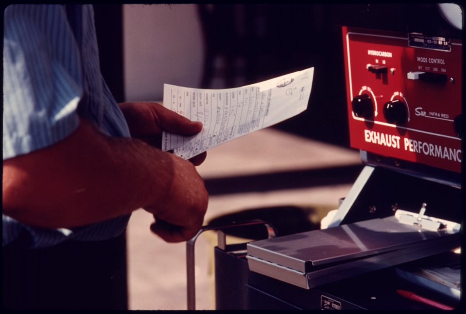 Closeup of an Employee Punching an Auto Emission Inspection Sheet at a Hamilton County Test Station in Newtown, Ohio...08-1975 (4266518612)