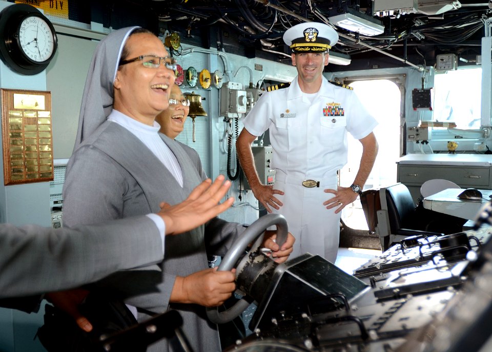 Cmdr. Justin Orlich gives a tour of his ship to nuns. (8678149629)