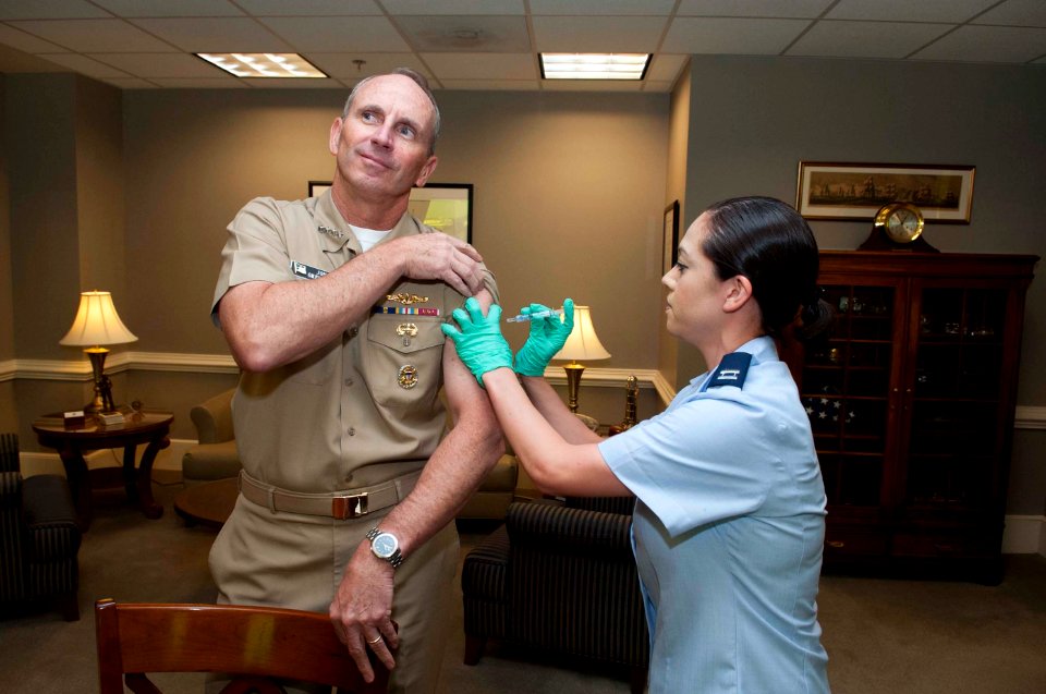 CNO Adm. Jonathan Greenert receives flu shot 131002-N-WL435-002