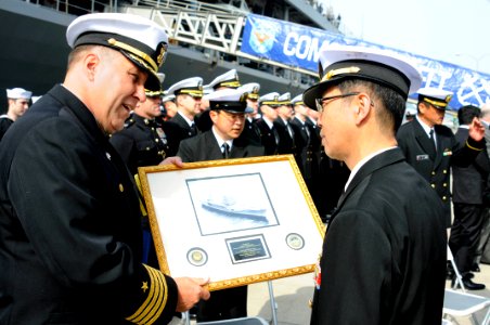 CO of USS Blue Ridge presents a gift to a Japanese officer. (8570977087)