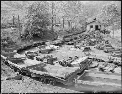 Coal cars on tracks leading from the mine to tipple. P V & K Coal Company, Clover Gap Mine, Lejunior, Harlan County... - NARA - 541301