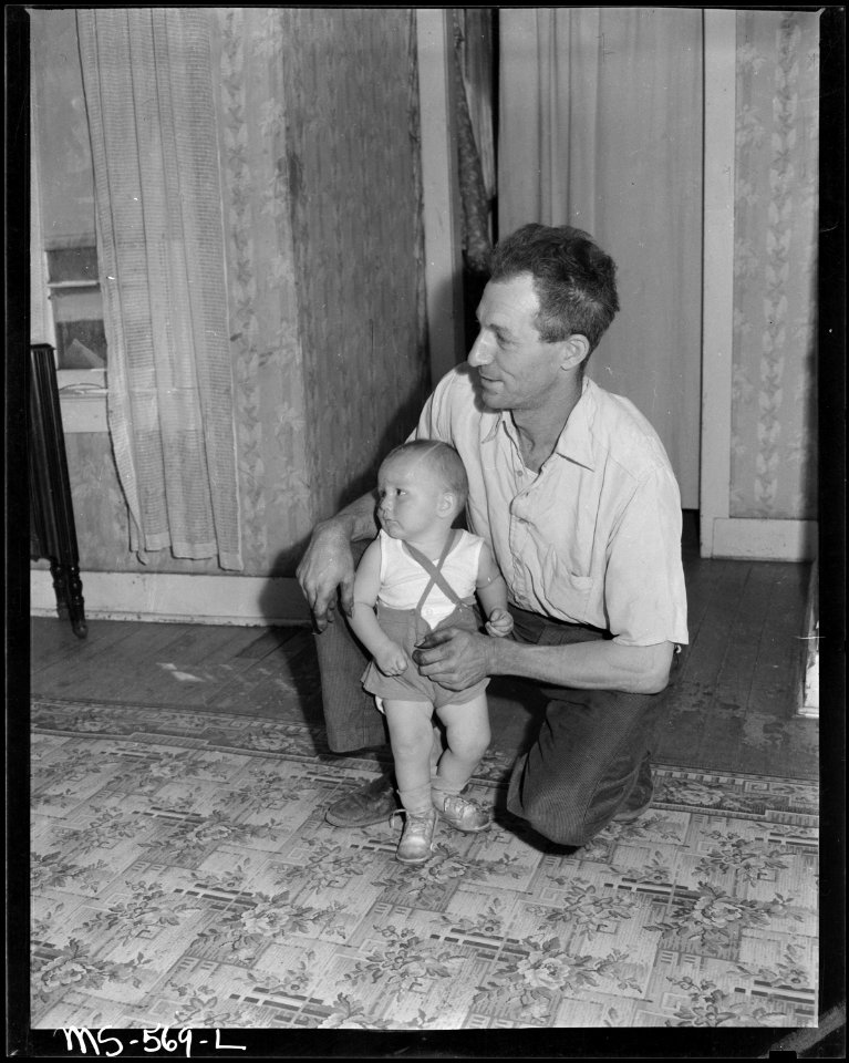 Coal miner and his son living in company housing project. Hudson Coal Company, Hudson Mine, Sweet Mine, Carbon... - NARA - 540494