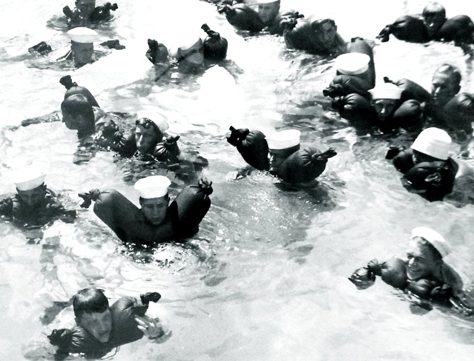 Coast Guardsmen float with water wings during WWII (27164412900)