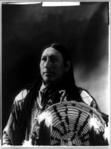 Big Man, half-length portrait, facing front holding decorated shield LCCN92509870