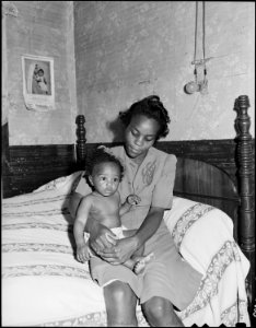 Big Sandy Housing Camp. Mines at Big Sandy closed and housing now occupied by Exeter Miners. Mrs. Beulah Wady, wife... - NARA - 540710