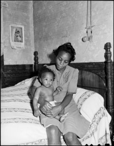 Big Sandy Housing Camp. Mines at Big Sandy closed and housing now occupied by Exeter Miners. Mrs. Beulah Wady, wife... - NARA - 540710