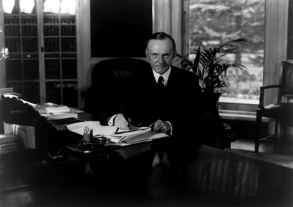 Calvin Coolidge seated at desk in Oval Office LOC3b39484r photo