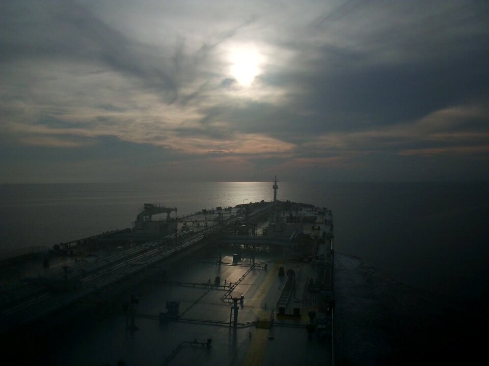 The open sea sunset ship