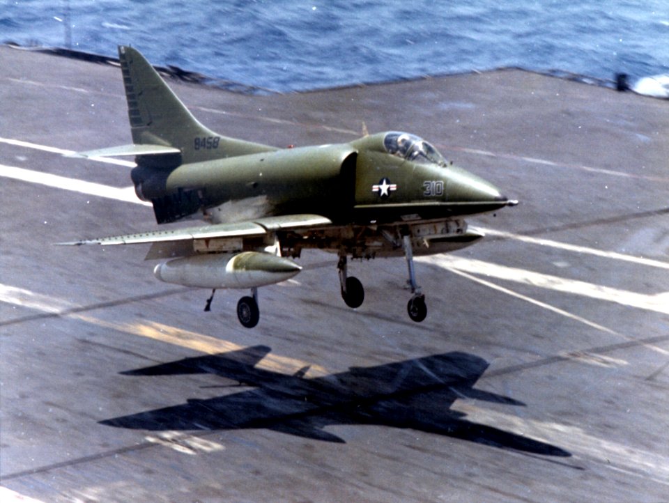 Camouflaged A-4C of VA-113 landing on USS Kitty Hawk (CVA-63) c1966