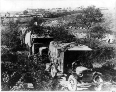 Camouflaged U.S. Army trucks at bivouac in France. 1918 LCCN2006691850