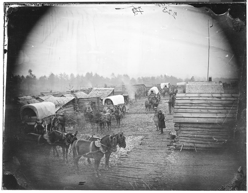 Camp scene. Showing winter huts and corduroy roads - NARA - 524642
