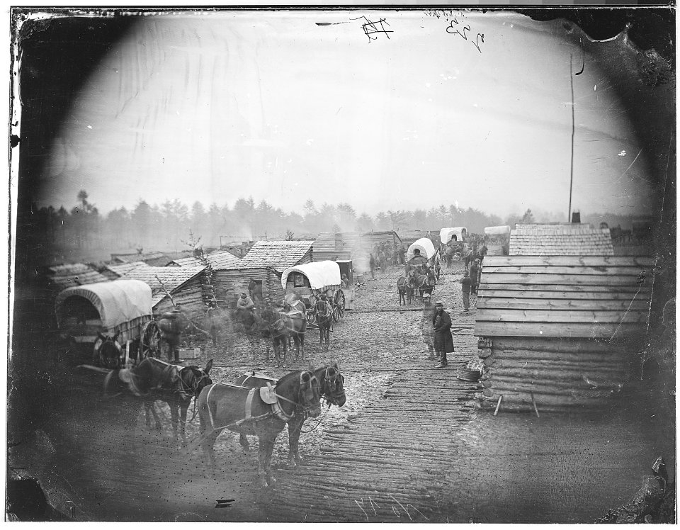 Camp scene. Showing winter huts and corduroy roads - NARA - 524642