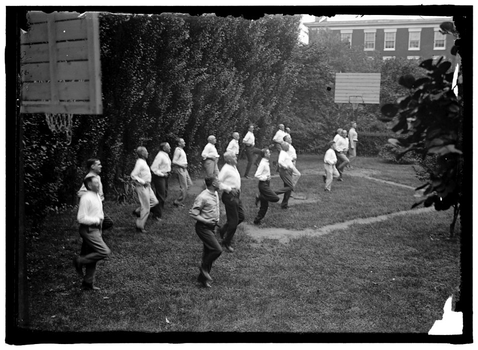 CAMP, WALTER, I.E., EXERCISE SCHOOL. CABINET OFFICIALS EXERCISING WITH OTHER GOVT. OFFICIALS LCCN2016868093