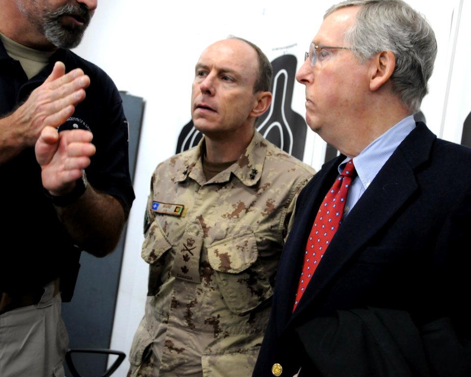 Canadian Maj. Gen. Ward and U.S. Senator Mitch McConnell talk with a police trainer advisor during a tour (4278169245)