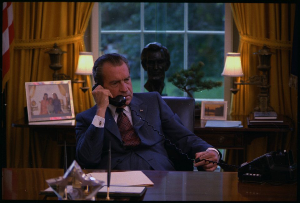 Candid photos of Richard M. Nixon at his desk in the oval office. The photos were taken during the filming of a film... - NARA - 194439