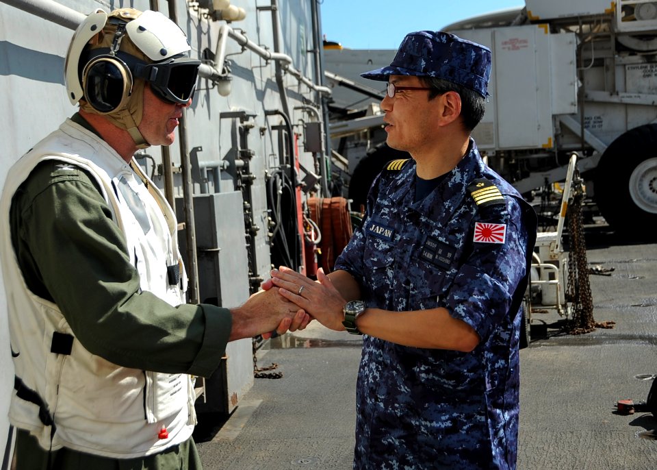 Capt. Craig Clapperton greets Capt. Masahiko Hoshino