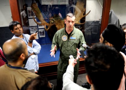 Capt. Craig Clapperton participates in an interview with the press during Exercise Malabar 2015